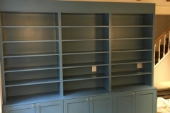 Large, custom-made bookcase unit in a sleek dark color, offering spacious storage solutions for contemporary spaces.  