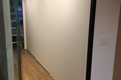 Contemporary wardrobe custom-designed with spacious wood cabinets in a natural tone.             