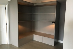 Custom-designed wardrobe featuring large, wood cabinets in a natural color and sleek finish.             S