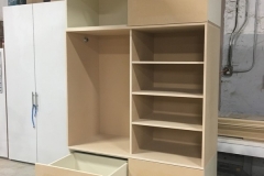 Spacious, custom-made wardrobe with elegant, hazelnut-colored cabinets.             