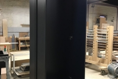 Custom, modern wardrobe with large, white cabinets and a built-in design.            