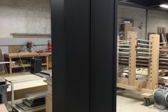 Elegant, custom-built wardrobe with big, light wood cabinets in a contemporary style.             