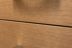 Sleek, modern wardrobe custom-built with big, white cabinets in a contemporary style.             