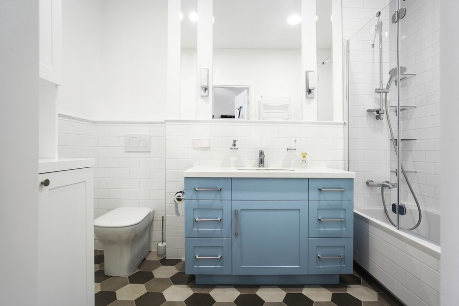 white bathroom with a light blue vanity