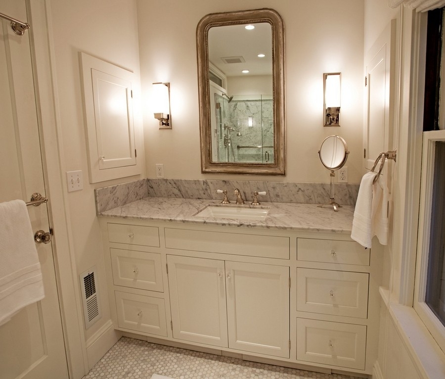 a bathroom in warm honey color with the same color vanity
