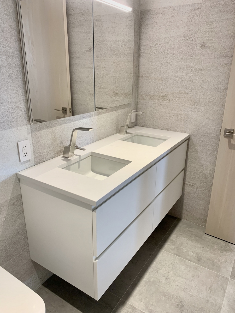 a small custom vanity with two rectangular sinks - angle view