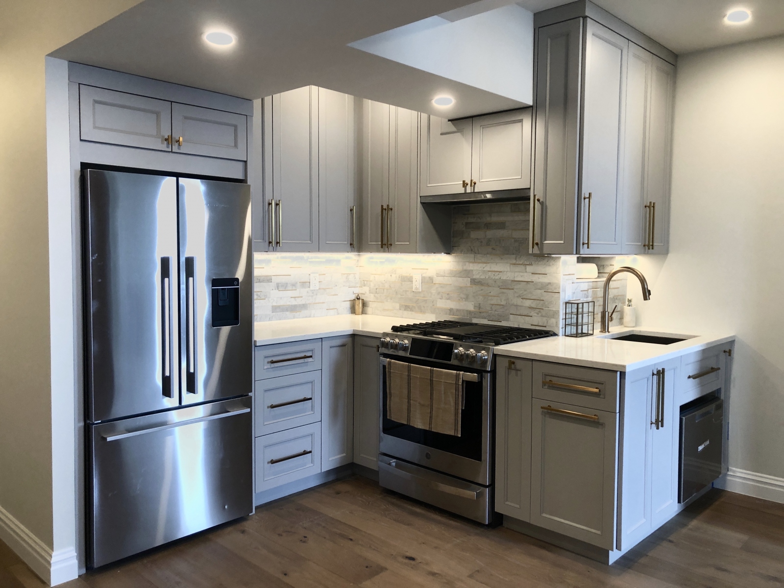 Bright, custom kitchen with spacious white cabinets,  and modern design.