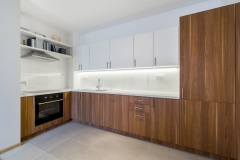Elegant, custom kitchen with large cabinets in a natural wood color and a contemporary feel.