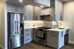 Bright, custom kitchen with spacious white cabinets,  and modern design.